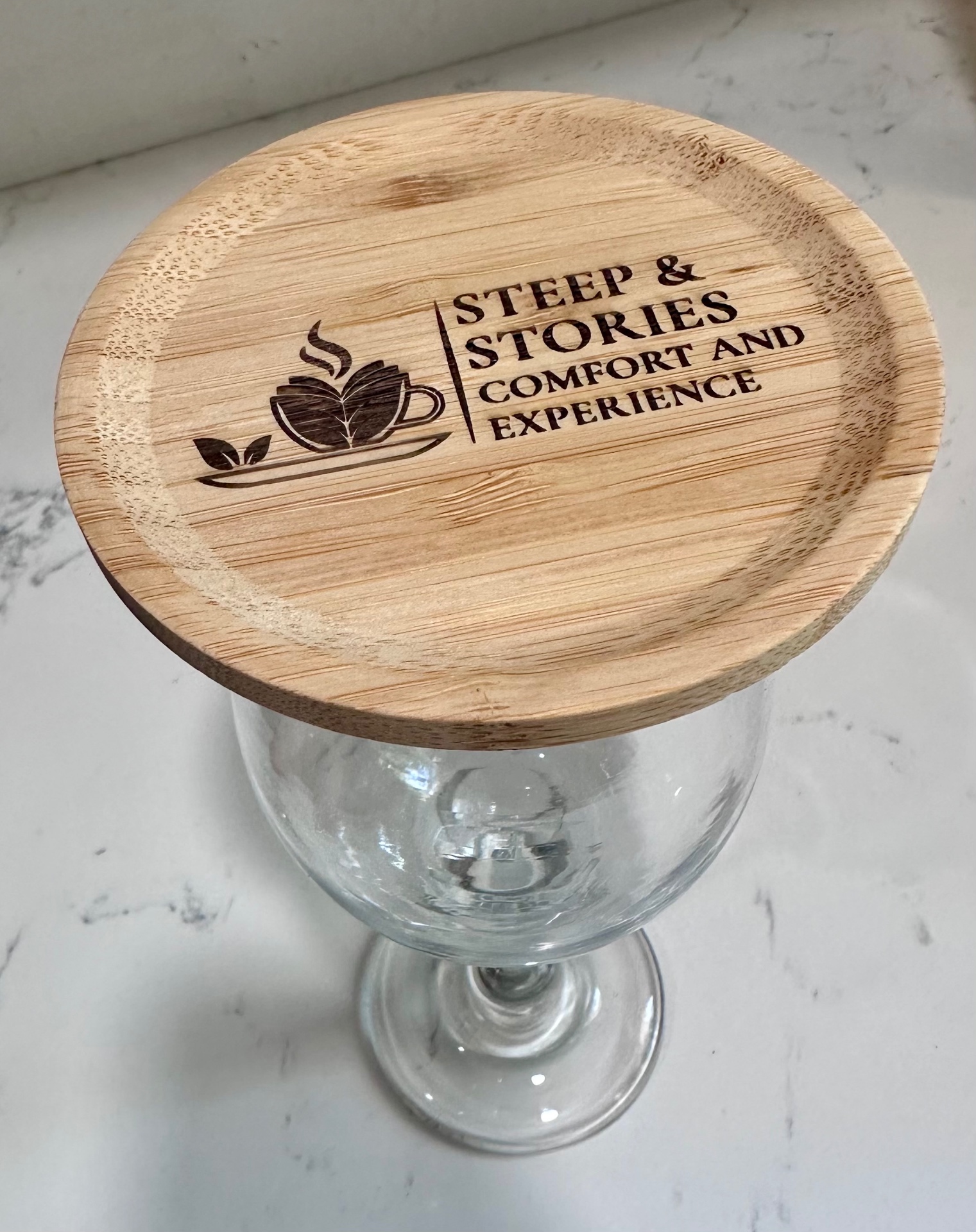 Bamboo charcuterie topper engraved with café logo